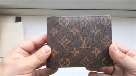 louis vuitton pouch mens fake|Louis Vuitton wallet men brown.